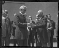 French Consul Louis Sentous presents Henry M. Robinson with Legion of Honor medal, Los Angeles, 1925