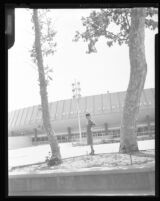 Woman posing in front of the Los Angeles Memorial Sports Arena, Los Angeles, 1960