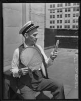 Fire Chief R. J. Scott with a fan during a heat wave, Los Angeles, 1935