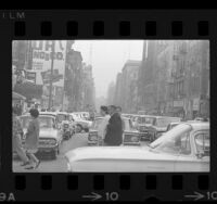 City street scene at Broadway and 2nd Street during transit strike in downtown Los Angeles, Calif., 1964