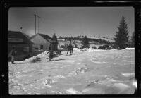 Sled dogs, men, cars, and toboggan in snow, recovery operation, June Lake, 1938