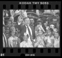 George W. H. Bush with ethnic performers during presidential campaign stop in Covina, Calif., 1988