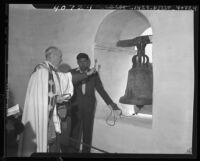M. L. Calac, Indian bell ringer of Padua Mission, sounds old San Fernando Mission bell, Los Angeles, 1946