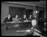 Gathered for the case of Aimee Semple McPherson's $2500 check are F. C. Clowdsley, Clare Woolwine, Walter Little, Harry Sewell, and William Hornblower, Los Angeles, 1929