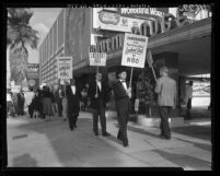 Pickets in dinner jackets, parade in front of Moulin Rouge club before the Emmy Awards in Los Angeles, Calif., 1959