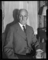 Admiral William S. Sims seated in a living room, Pasadena, 1933