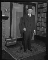 City Councilman Robert L. Burns models plug hat, Los Angeles, 1935