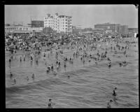 Crowd celebrating the Fourth of July holiday on a beach, Santa Monica, 1929