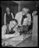 Al Horton and Leo McDonald with the wandering possum, Los Angeles, 1936