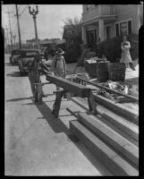 Workers engaged in reconstruction in front of a building after the Long Beach earthquake, Southern California, 1933