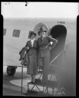 Actors Florence Rice and Michael Bartlett at door of airplane, 1935