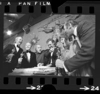 Actors on the set of "The Poseidon Adventure" celebrating their Oscars wins, 1972