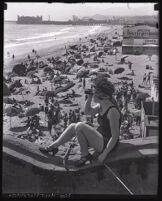 Woman with a spyglass at Ocean Park, Santa Monica, 1920s