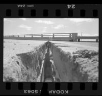 Earthquake damage, 5-inch crack on California Route 111 overpass, Palm Springs (vicinity), 1986