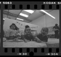 Three infants at play in day care center for Skid Row residents in Los Angeles, Calif., 1981