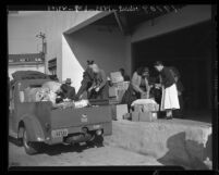 Donated supplies for Navajo and Hopi Indians in Arizona and New Mexico being unloaded at the Navajo Trail Relief Caravan