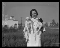 Mercedes Hill holding Japanese spaniels at the county fair dog show, Pomona, 1935