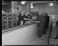 John C. Porter, mayor of Los Angeles, helping in a soup line, Los Angeles, 1929-1933