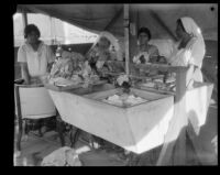 Women washing clothes in a tent laundry after the failure of the Saint Francis Dam and resulting flood, Santa Clara River Valley (Calif.), 1928