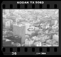 LAPD helicopter in-flight over downtown near One Wilshire building in Los Angeles, Calif., 1988