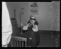 F. W. Phillips, guest of Lorraine Walsh, at police station, Los Angeles, 1935