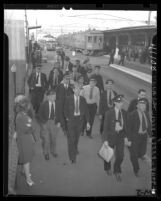 Pacific Electric employees walking off job at Sixth and Main Sts. Terminal in sympathy strike, Los Angeles, Calif., 1946