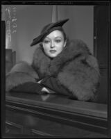 Film actress Lona Andre sits on witness stand for annulment proceeding, Los Angeles, 1935