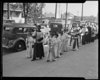 Altar boys entering the St. Patrick Catholic Church to attend the mass for St. John Bosco, Los Angeles, 1935