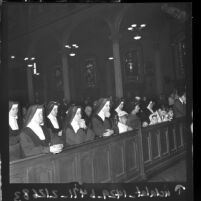 Nuns at High Mass on Thanksgiving Day at St. Vibiana's Cathedral in Los Angeles, Calif., 1961