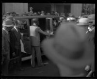 Hayward Thompson gets into car for blindfolded drive, Los Angeles, 1927