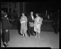 Mrs. George B. Macaulay, Mr. and Mrs. Wesley Roberts arrive at the Shrine for the opera, Los Angeles, 1926