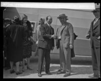 Anthony Fokker and Harris M. Hanshue pose as they shake hands, [Montebello?], [1928]