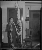 Soichi Ito with an Onagadori, long-tailed chicken, at the Olympic Hotel, Los Angeles, 1935