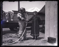 Minnie Kennedy interviews R. C. Crawford during search for Aimee Semple McPherson's body, Santa Monica, 1926