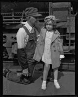 Ginnette Hoyet Marboeu, a French Shirley Temple lookalike, visits the United States with her grandfather, Chas Diffenbaugh, Los Angeles, 1936