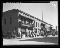 Whiting-Mead workers salvaging doors and windows from old Chinatown[?] building in Los Angeles, Calif., circa 1935