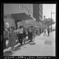 Students and sympathizers parading westward on Wilshire Blvd for world peace and disarmament; Los Angeles, Calif., 1960