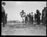 Pacific Fleet broad jumper competes during the championship track meet, Long Beach, 1922