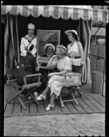 Antoinette Mahoney, Peggy Terry and Dorothy Walsh help Janet Hubbard with her make-up, Los Angeles, 1936