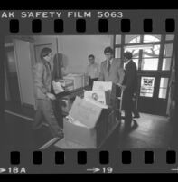 State Senator Alan Robbins and Reverend W. C. Jackson wheeling antibusing initiative petitions into the Los Angeles County Registrar-Recorder's office, 1978