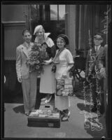 Aimee Semple McPherson with her children, Rolf and Roberta in front of a train car, Los Angeles, 1935