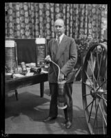 Arthur C. Burch with fire extinguishing equipment, Los Angeles, ca. 1920s