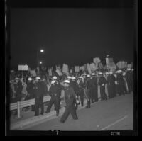 Protesters near Century Plaza meet a police barrier during President Johnson's visit, 1967