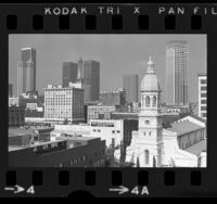 Cityscape with St. Vibiana's Cathedral and high-rise buildings in downtown Los Angeles, Calif., 1973