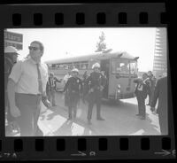 Police around bus at Avenue of the Stars during President Johnson's visit, 1967