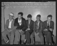 Monte Carlo robbery suspects sit along a bench, Los Angeles, 1935