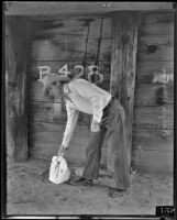 Dr. Ralph Waldo Wagner leaving fake money for extortionists by a bridge, Santa Clarita, 1935