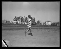 Pacific Fleet track and field athlete stands on the competition field, Long Beach, 1922