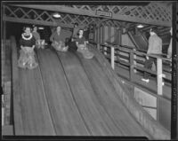 Ann McNaghten and friends on a slide, Venice (Los Angeles), 1936