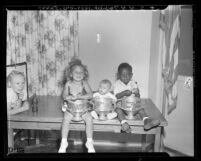 Three winners of a baby contest held by residents of housing projects in Los Angeles, Calif., 1948